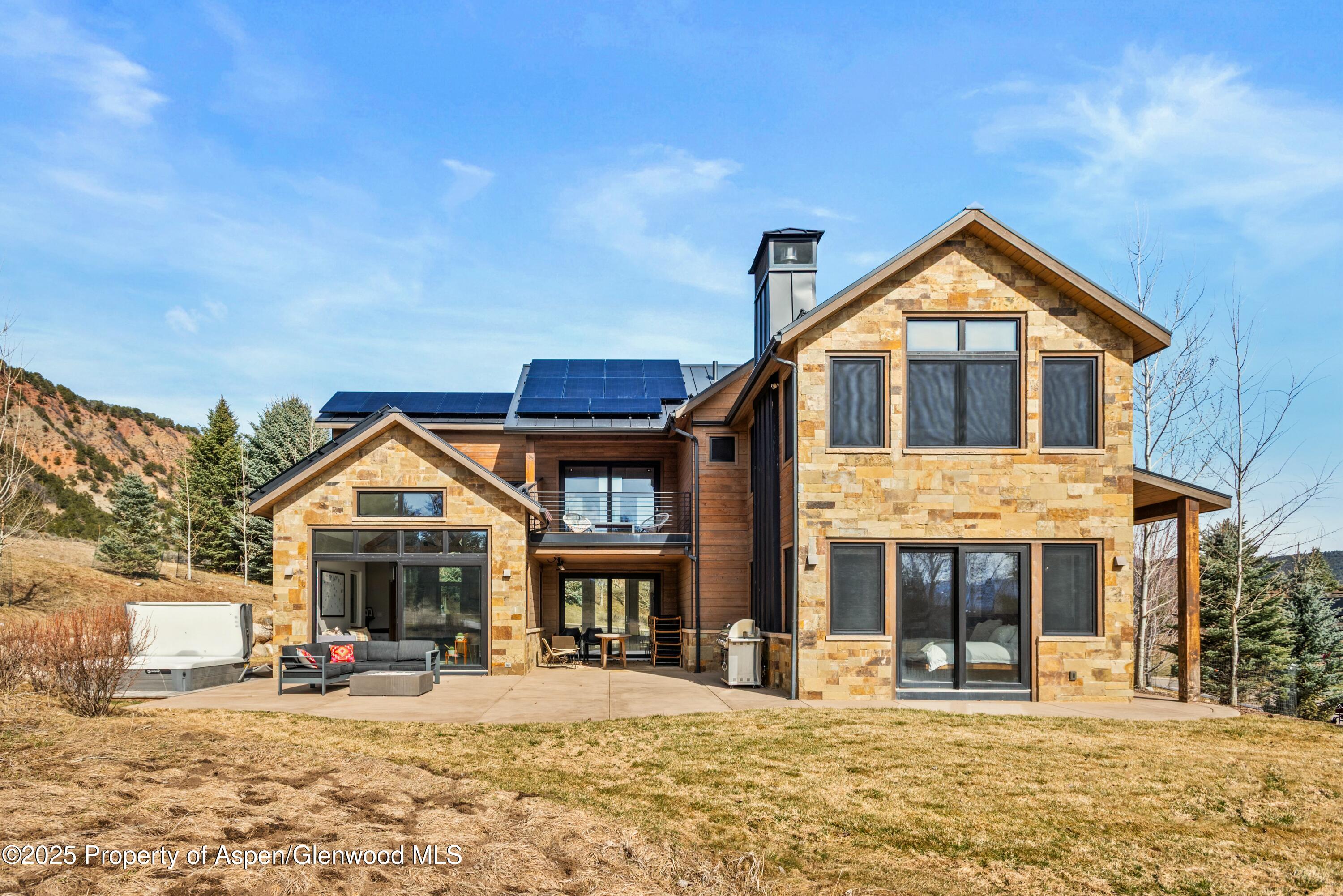 649 Saddleback Road Carbondale, CO 81623 - Photo 3 of 37 a front view of a house with a yard