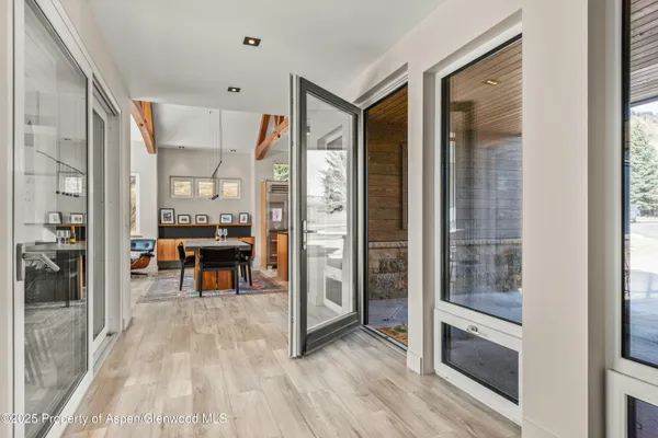 a view of living room filled with furniture and wooden floor