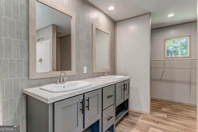 a bathroom with a sink and a mirror