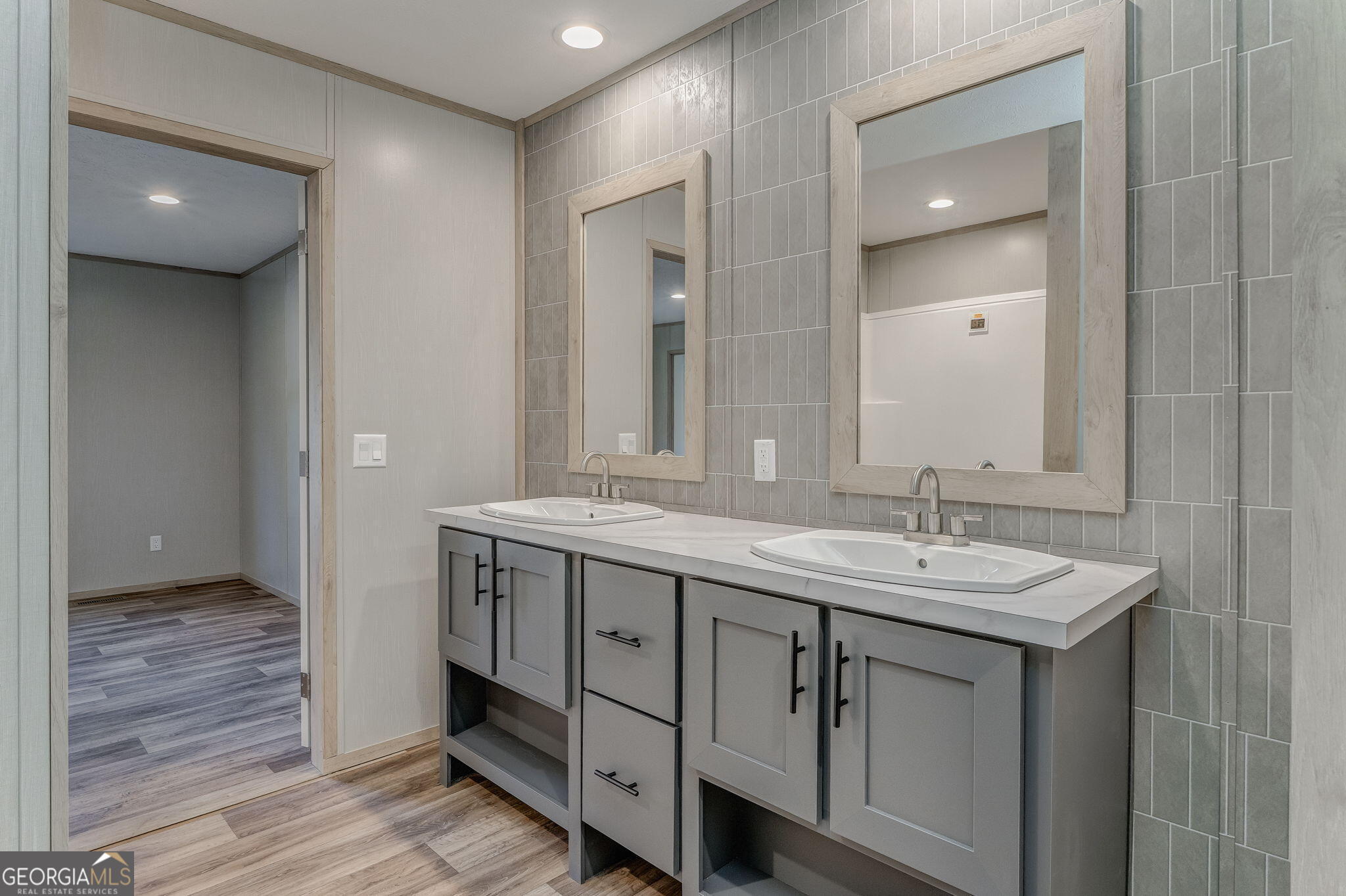 865 Old Rockmart Road Southeast Silver Creek, GA 30173 - Photo 19 of 52 a bathroom with a granite countertop double vanity sink and a mirror