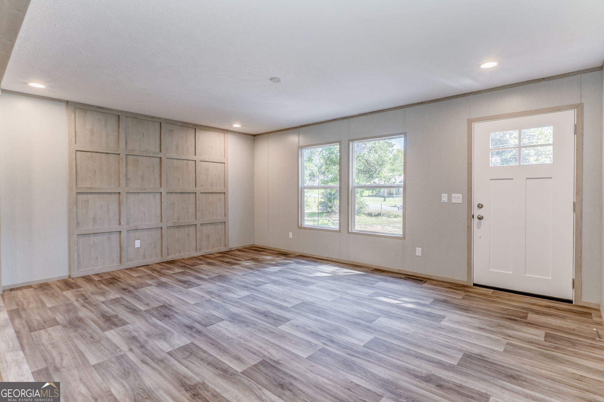 865 Old Rockmart Road Southeast Silver Creek, GA 30173 - Photo 20 of 52 a view of an empty room with wooden floor and a window