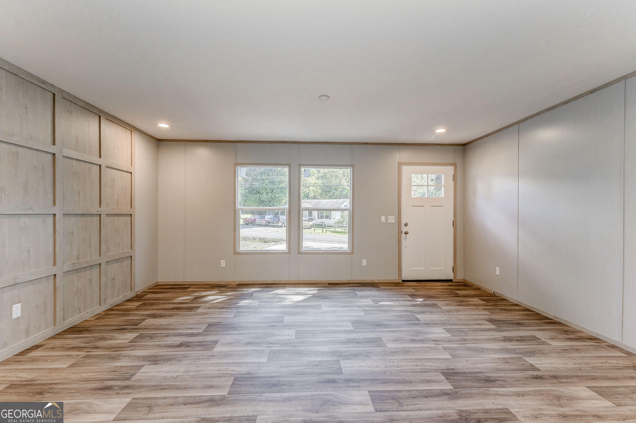 865 Old Rockmart Road Southeast Silver Creek, GA 30173 - Photo 24 of 52 a view of an empty room with wooden floor and a window