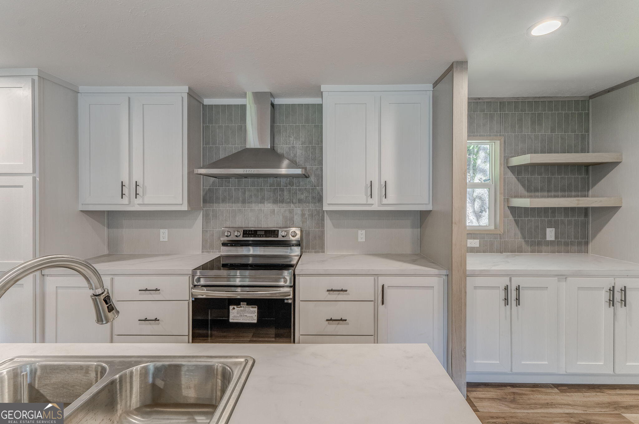 865 Old Rockmart Road Southeast Silver Creek, GA 30173 - Photo 25 of 52 a kitchen with granite countertop a stove and a sink