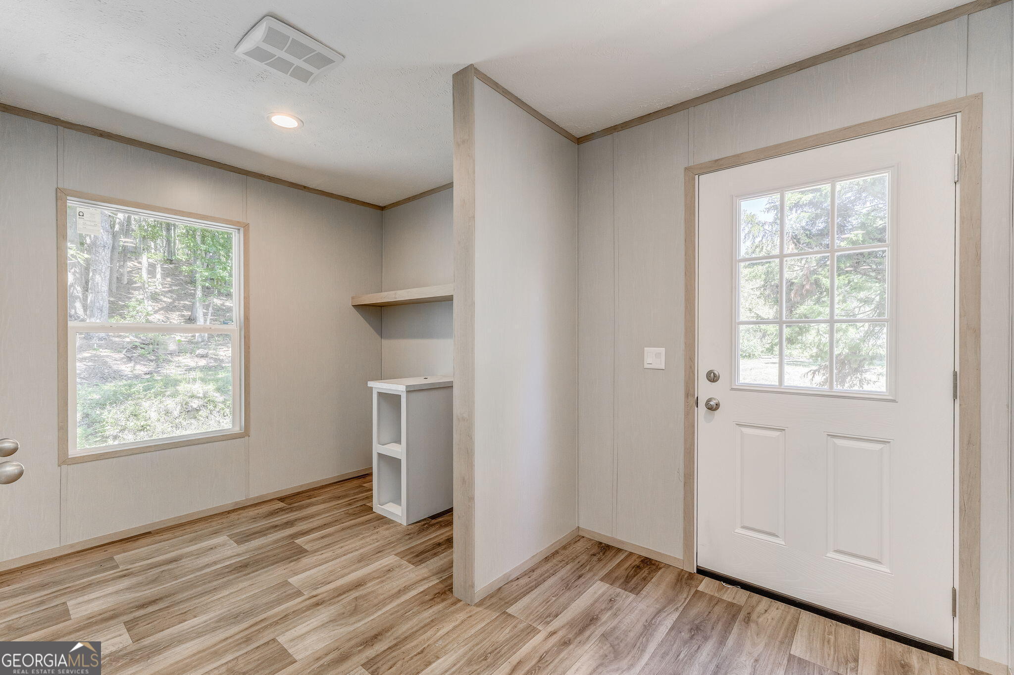 865 Old Rockmart Road Southeast Silver Creek, GA 30173 - Photo 30 of 52 a view of an empty room with wooden floor and a window