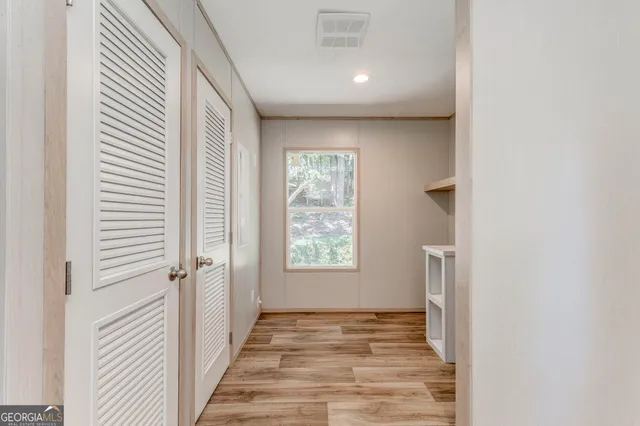 a view of an empty room with a window