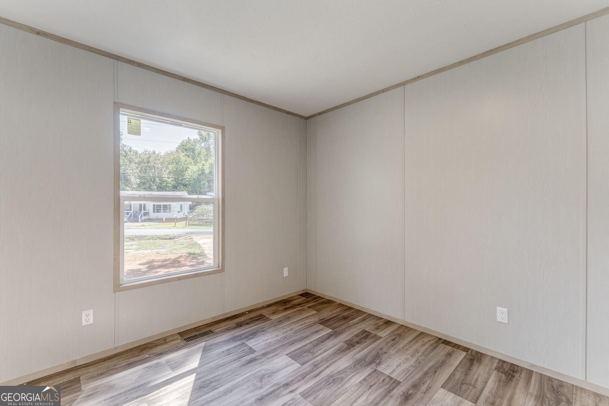 865 Old Rockmart Road Southeast Silver Creek, GA 30173 - Photo 36 of 52 an empty room with wooden floor and windows