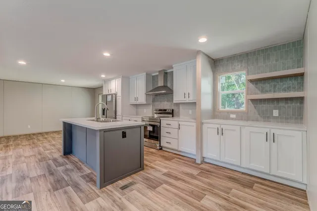 a kitchen with a sink and cabinets