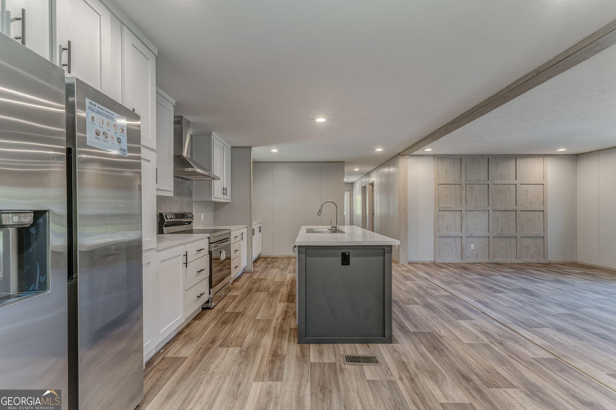865 Old Rockmart Road Southeast Silver Creek, GA 30173 - Photo 6 of 52 a kitchen with kitchen island wooden floors appliances and cabinets