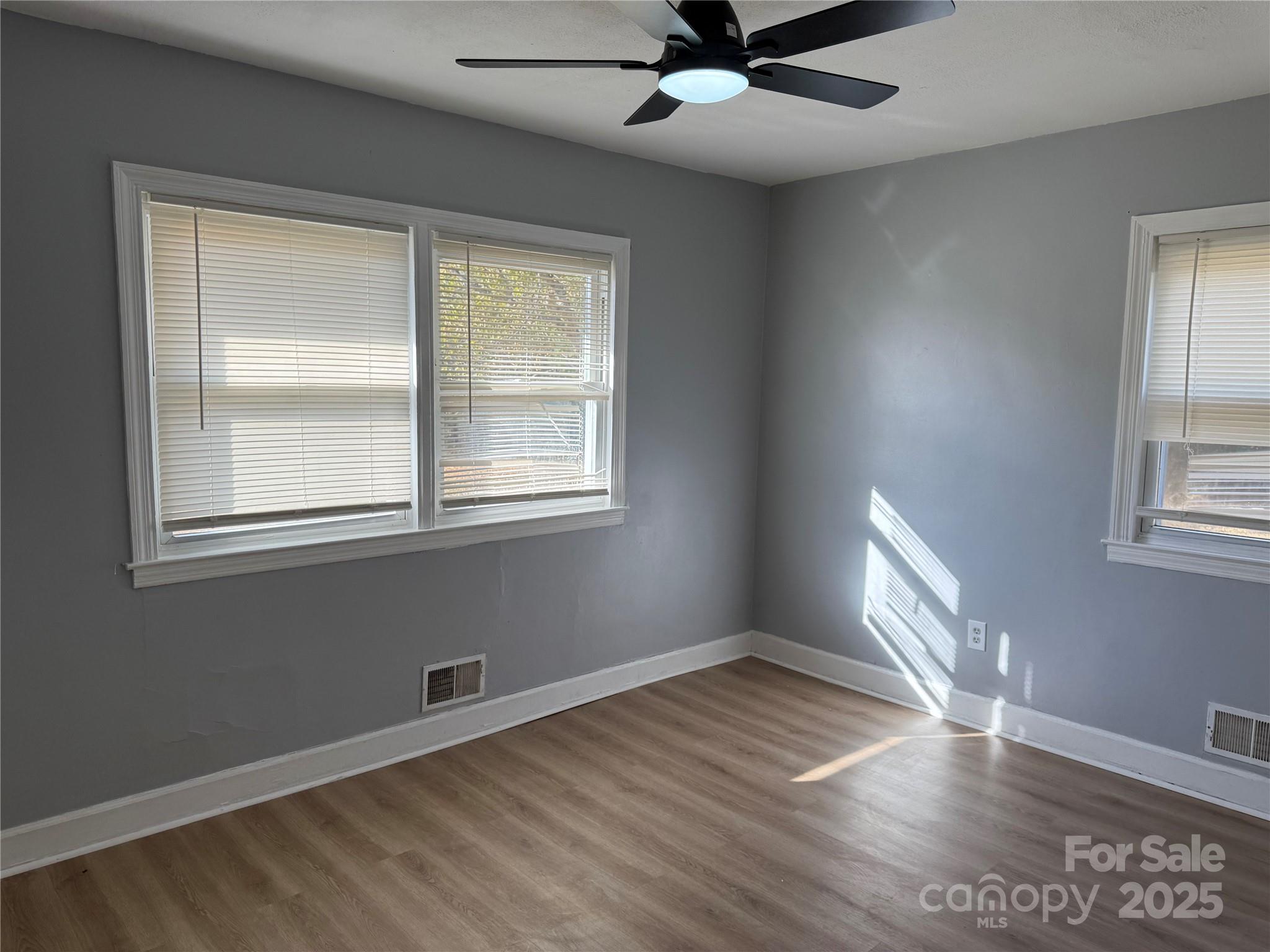 305 Tec Road Cheraw, SC 29520 - Photo 15 of 21 a view of an empty room with wooden floor and a window