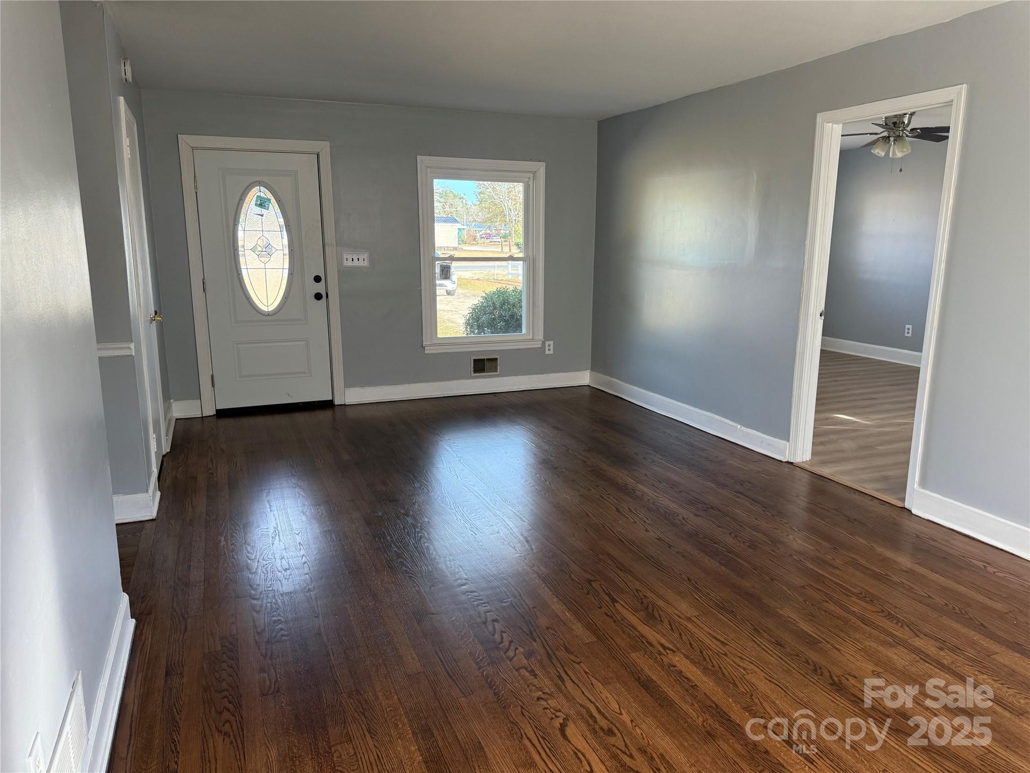 305 Tec Road Cheraw, SC 29520 - Photo 18 of 21 an empty room with wooden floor and a window