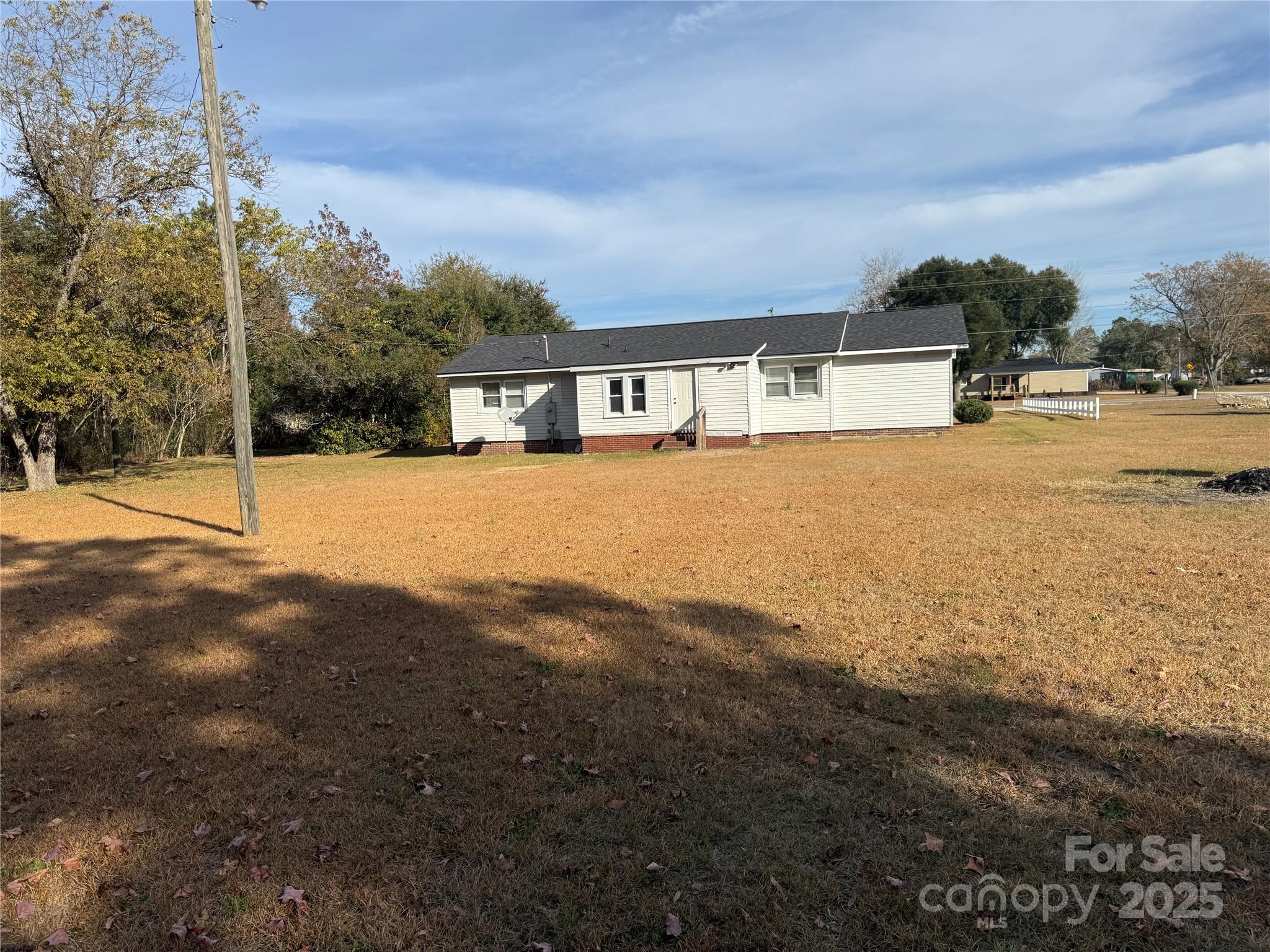 305 Tec Road Cheraw, SC 29520 - Photo 20 of 21 a front view of a house with a yard