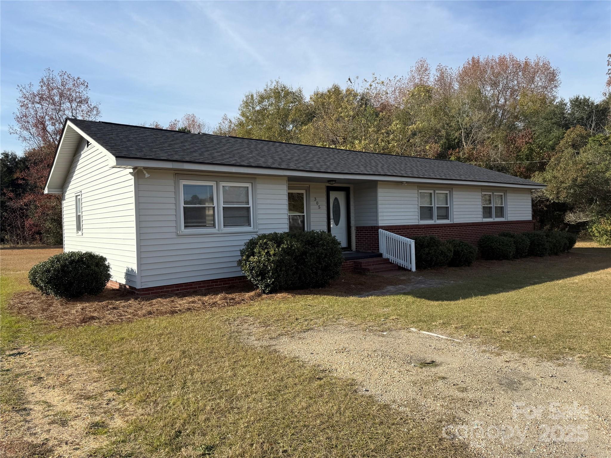 305 Tec Road Cheraw, SC 29520 - Photo 21 of 21 a view of a house with a yard and a large window