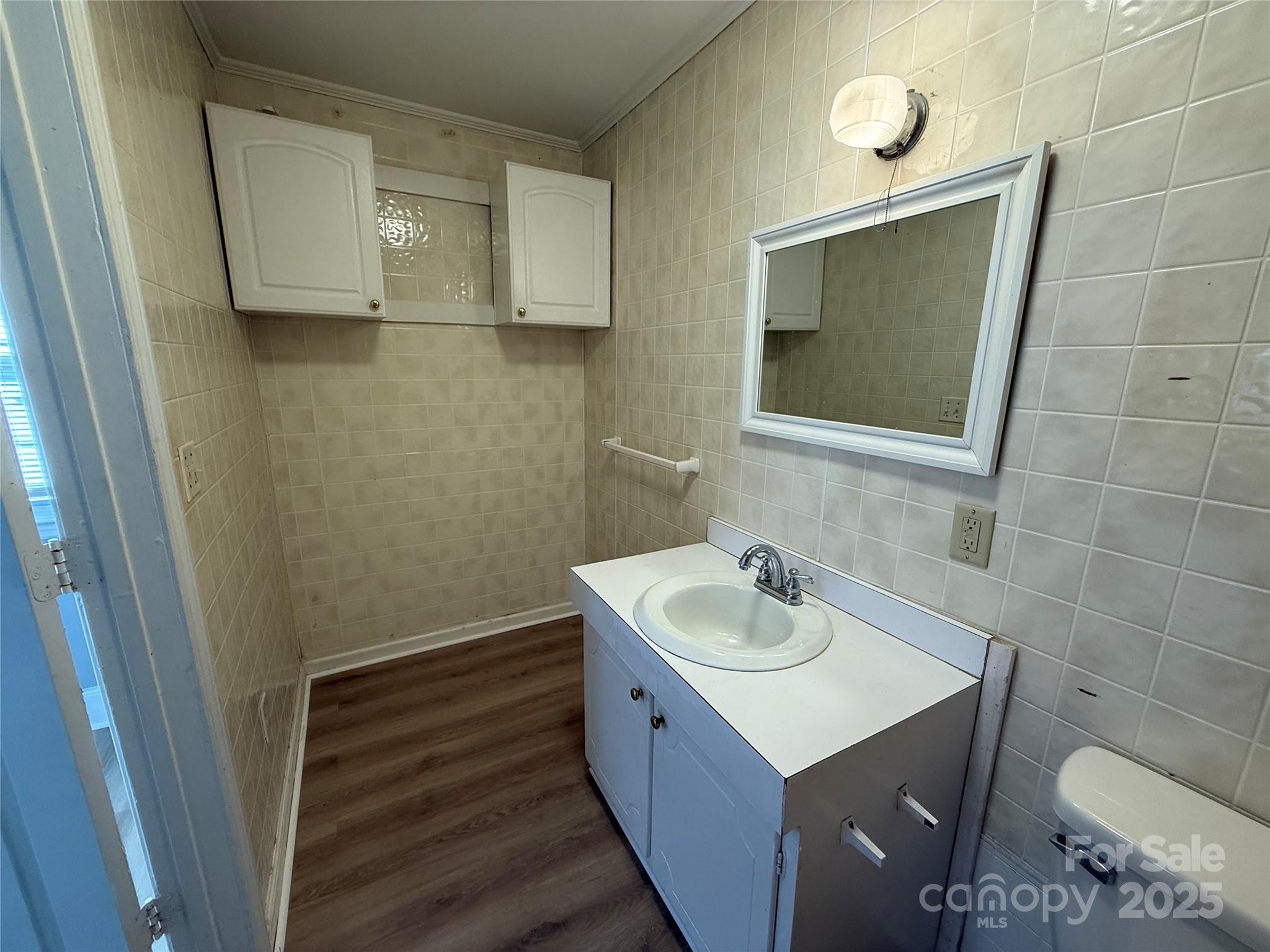 305 Tec Road Cheraw, SC 29520 - Photo 5 of 21 a bathroom with a sink and a mirror