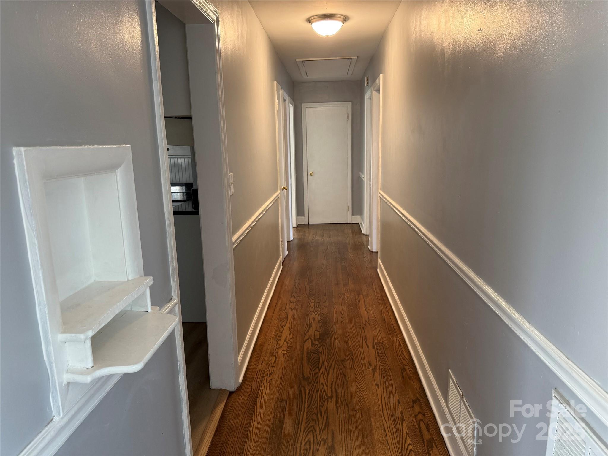 305 Tec Road Cheraw, SC 29520 - Photo 7 of 21 a view of a hallway with wooden floor and staircase
