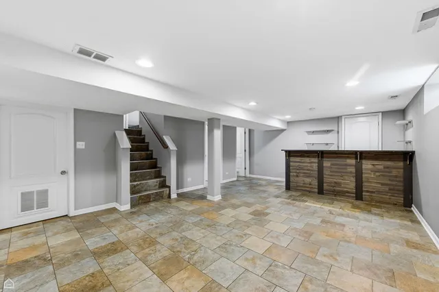 a view of an empty room with a cabinet