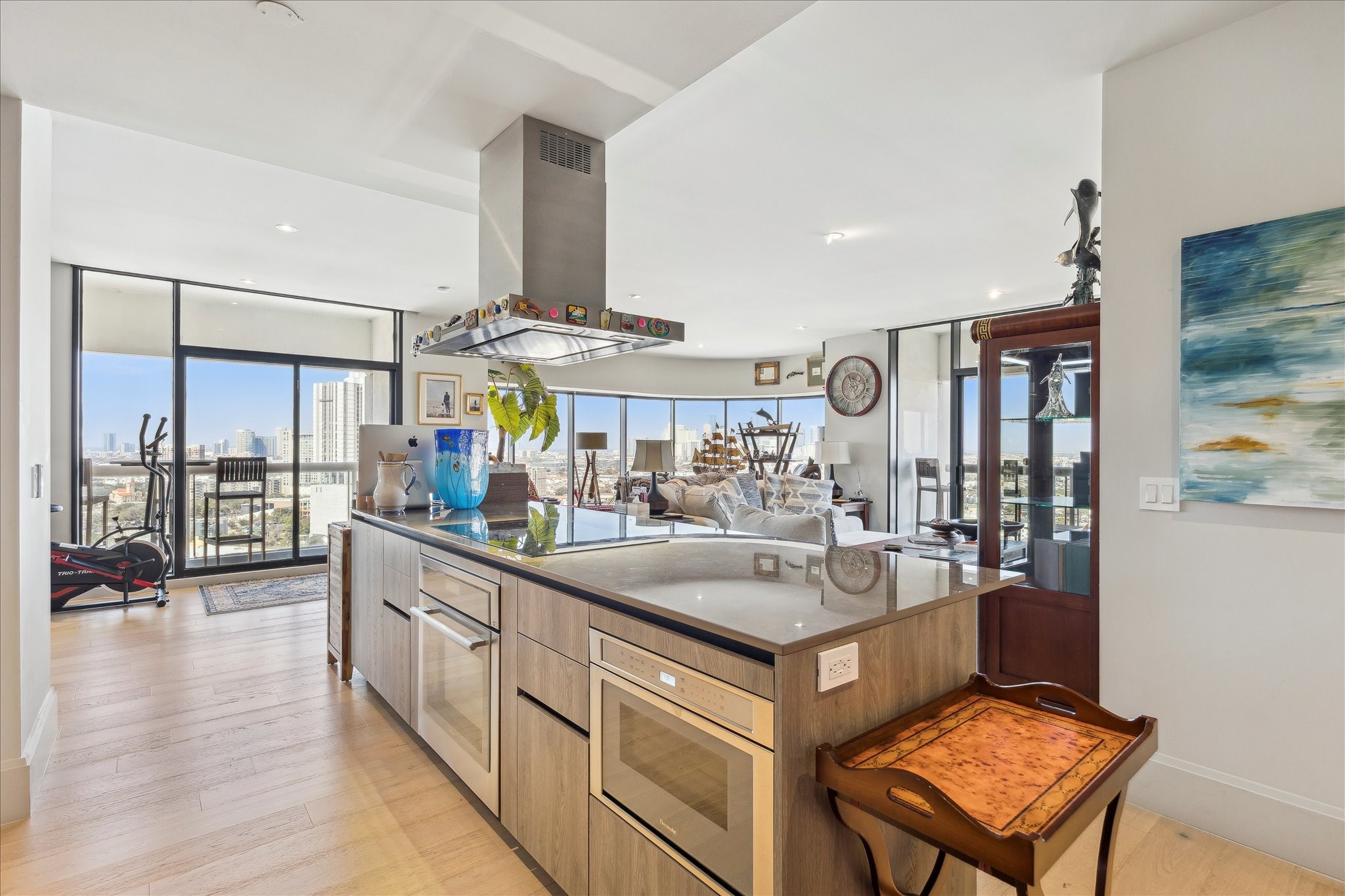 a kitchen with a stove a refrigerator and dining table