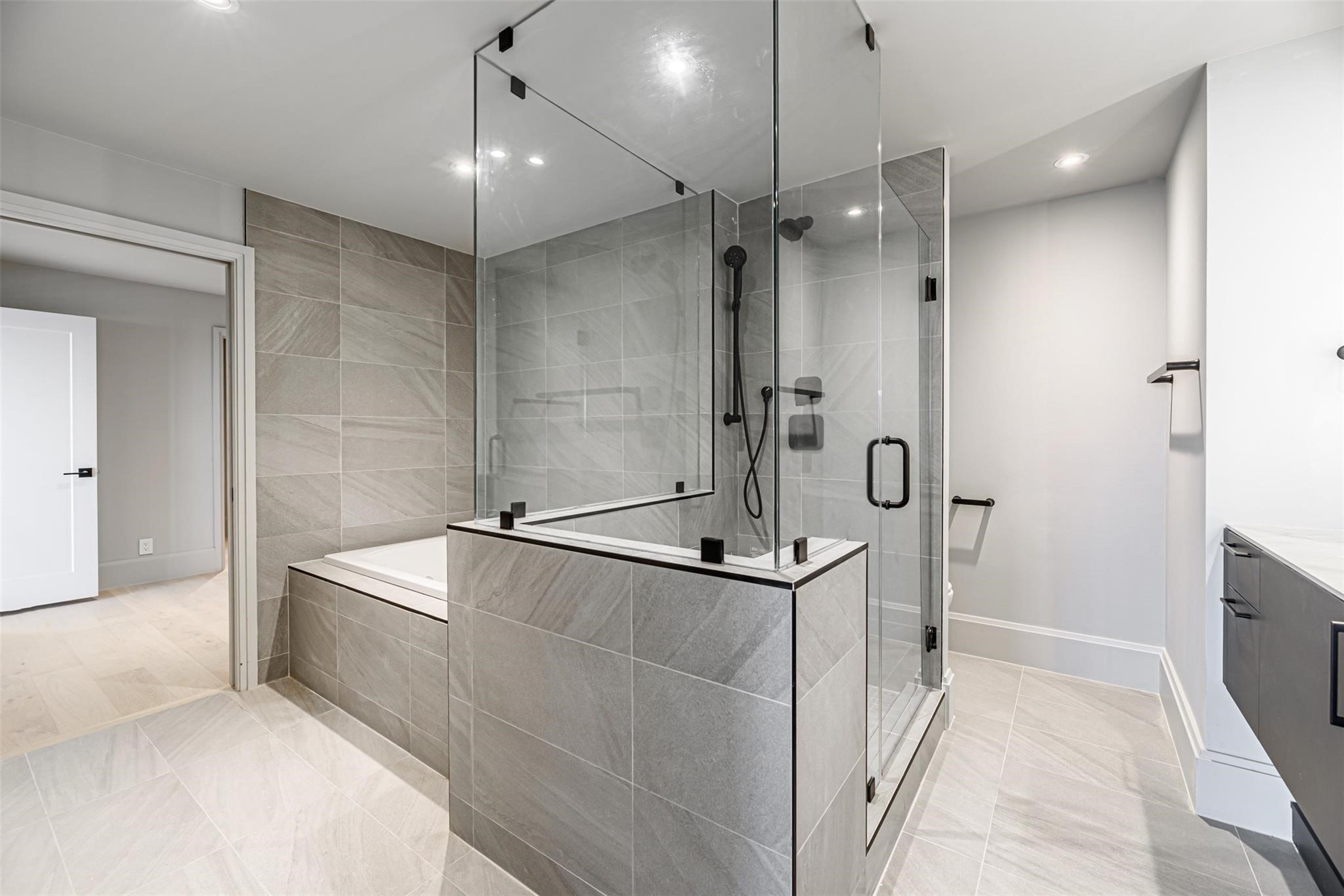 1701 Hermann Drive, Unit 22CE Houston, TX 77004 - Photo 13 of 37 a bathroom with a shower and a sink