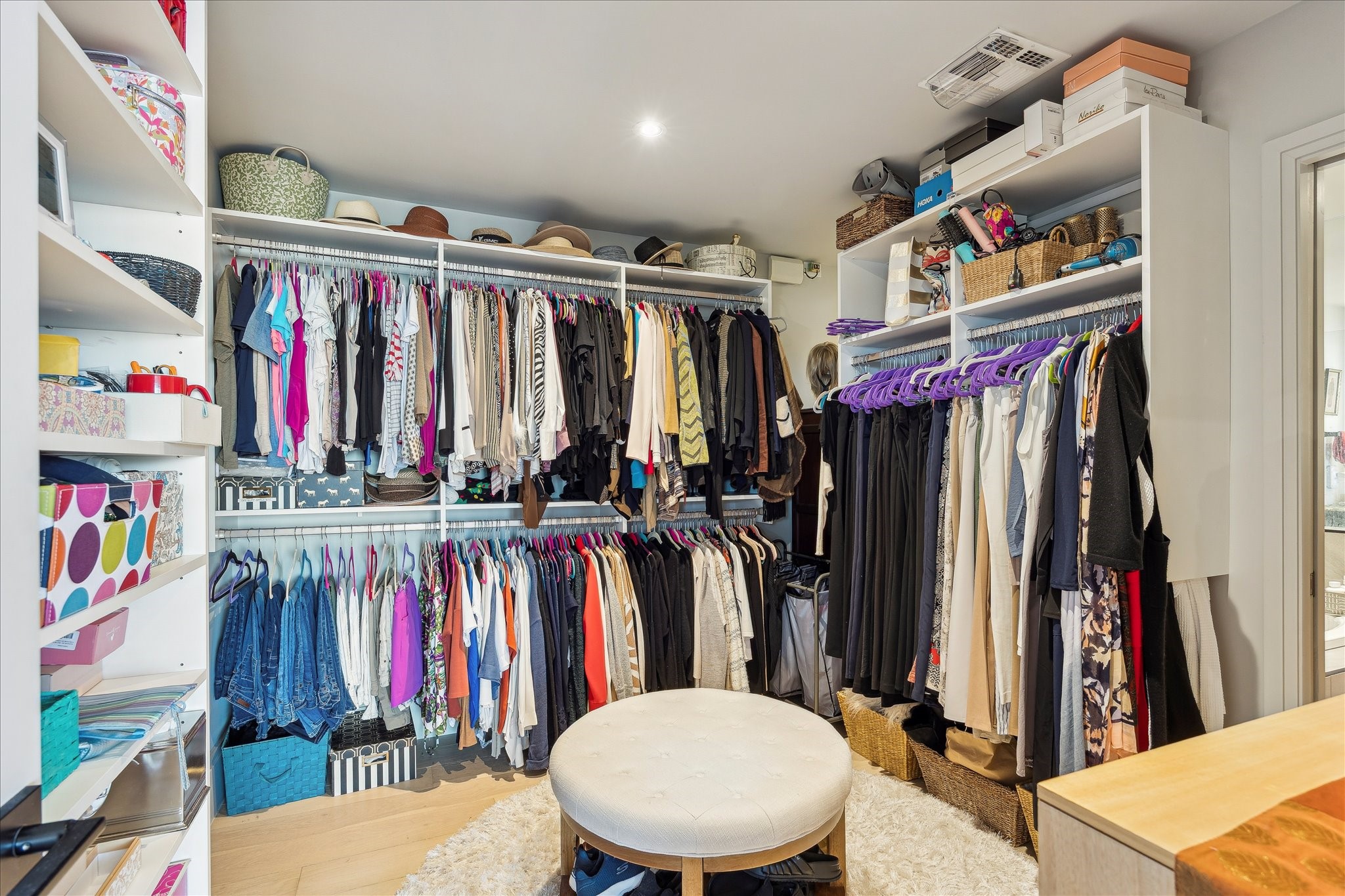 1701 Hermann Drive, Unit 22CE Houston, TX 77004 - Photo 14 of 37 a view of walk in closet with clothes