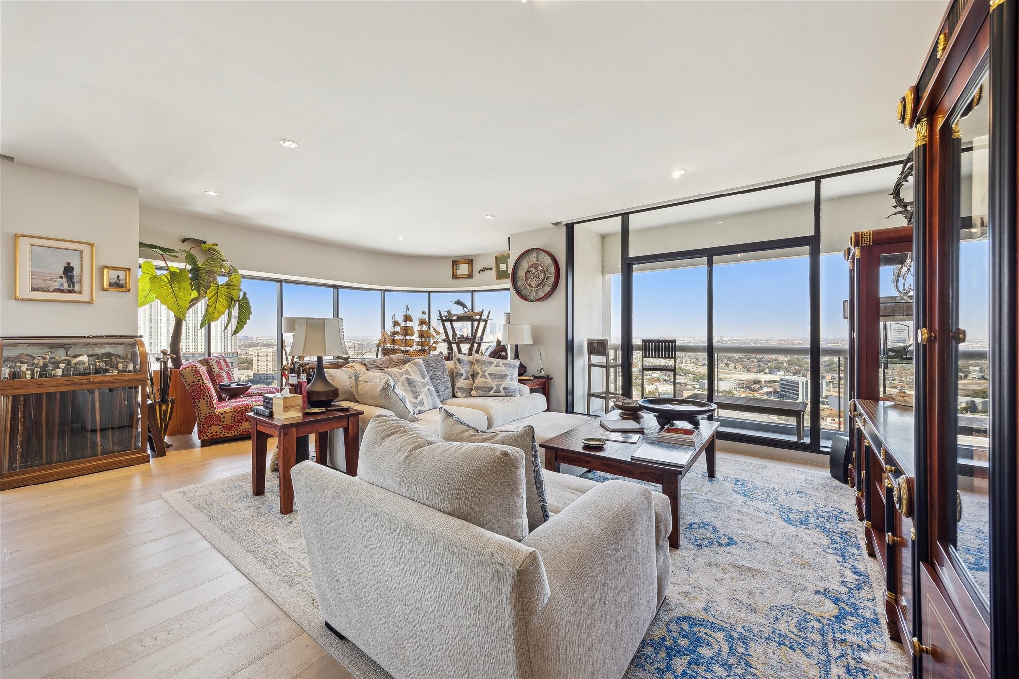 1701 Hermann Drive, Unit 22CE Houston, TX 77004 - Photo 2 of 37 a living room with furniture and a floor to ceiling window