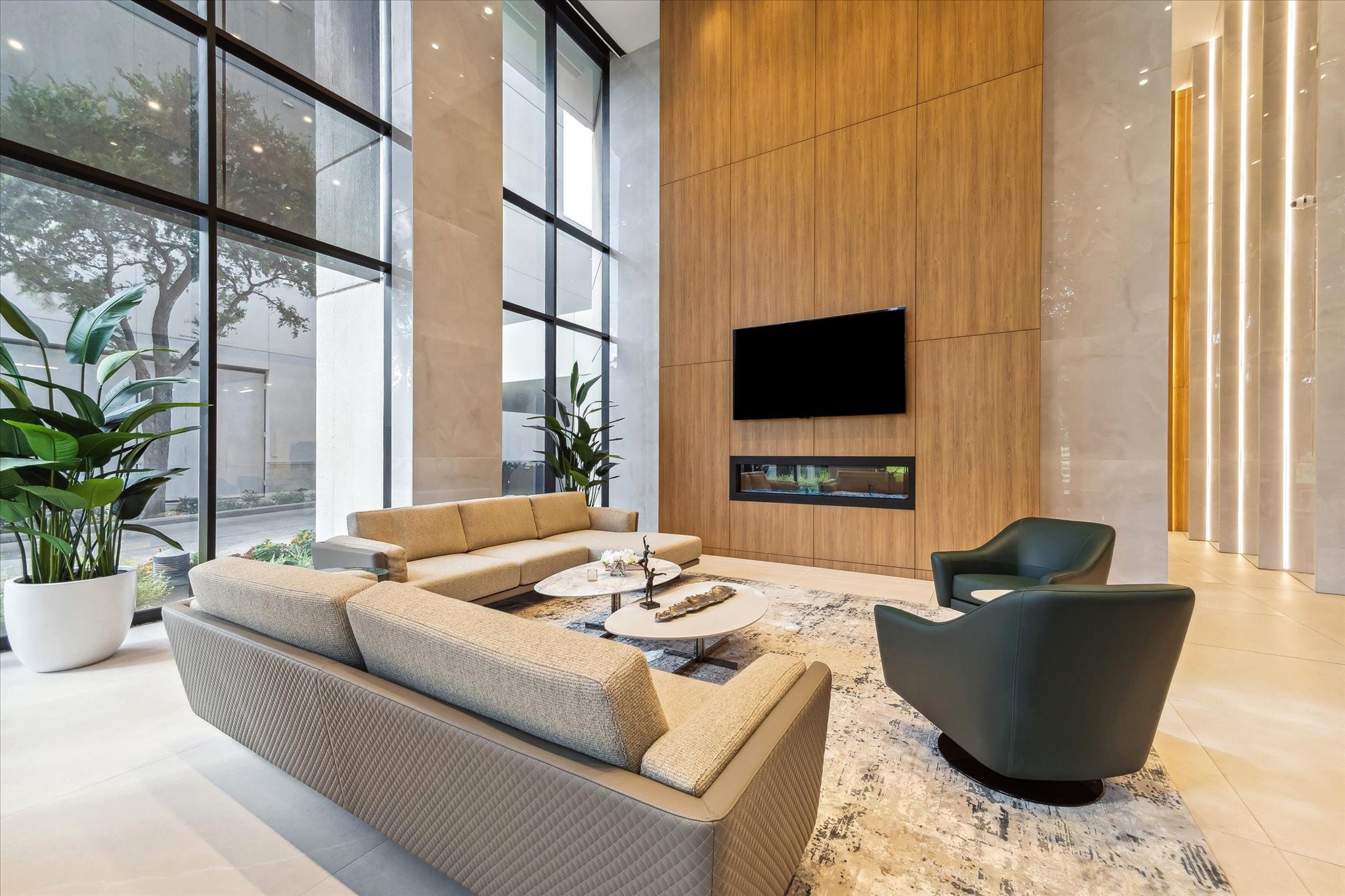 1701 Hermann Drive, Unit 22CE Houston, TX 77004 - Photo 30 of 37 a living room with furniture and a flat screen tv