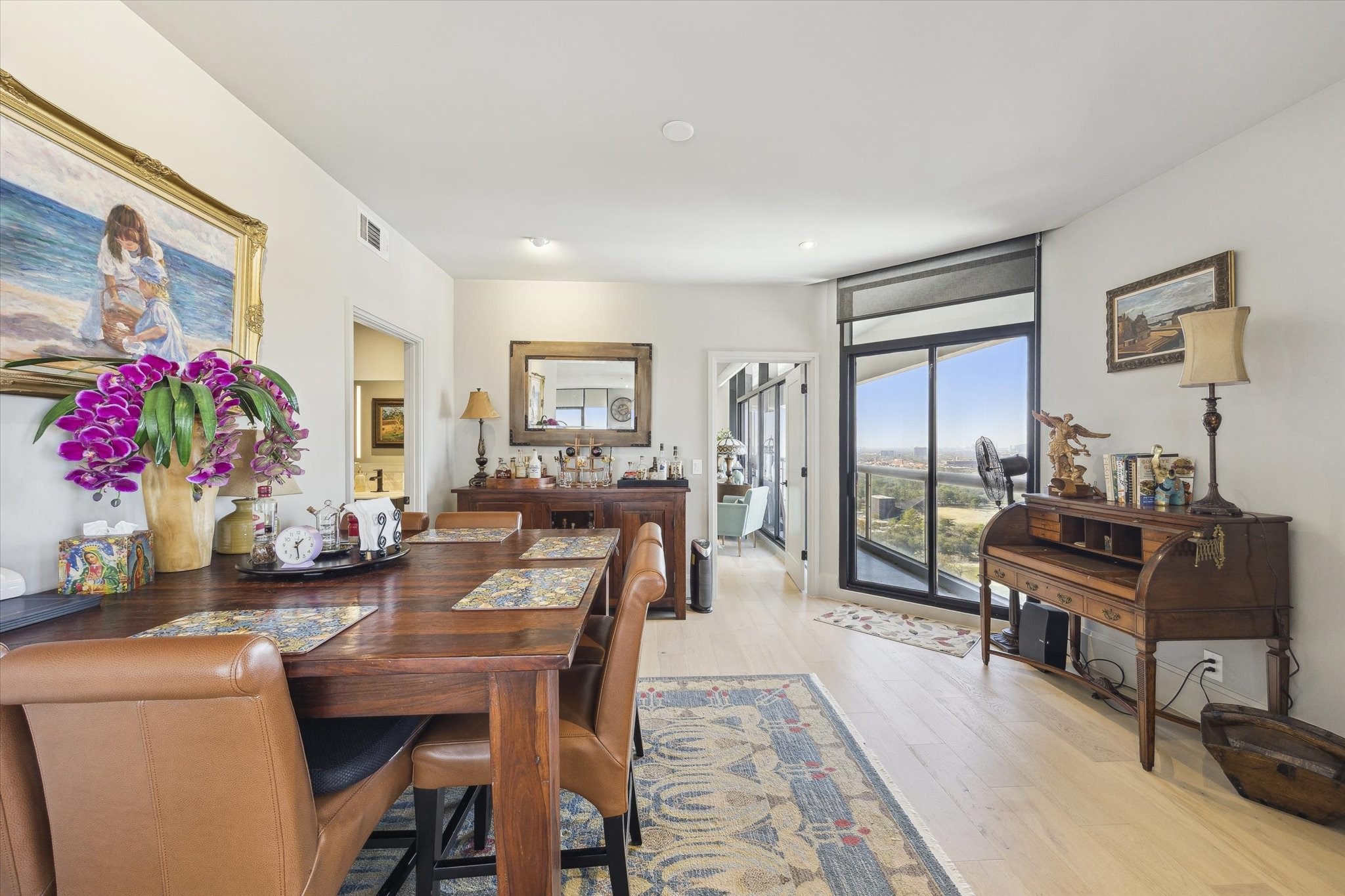 1701 Hermann Drive, Unit 22CE Houston, TX 77004 - Photo 7 of 37 a living room with furniture and a flat screen tv
