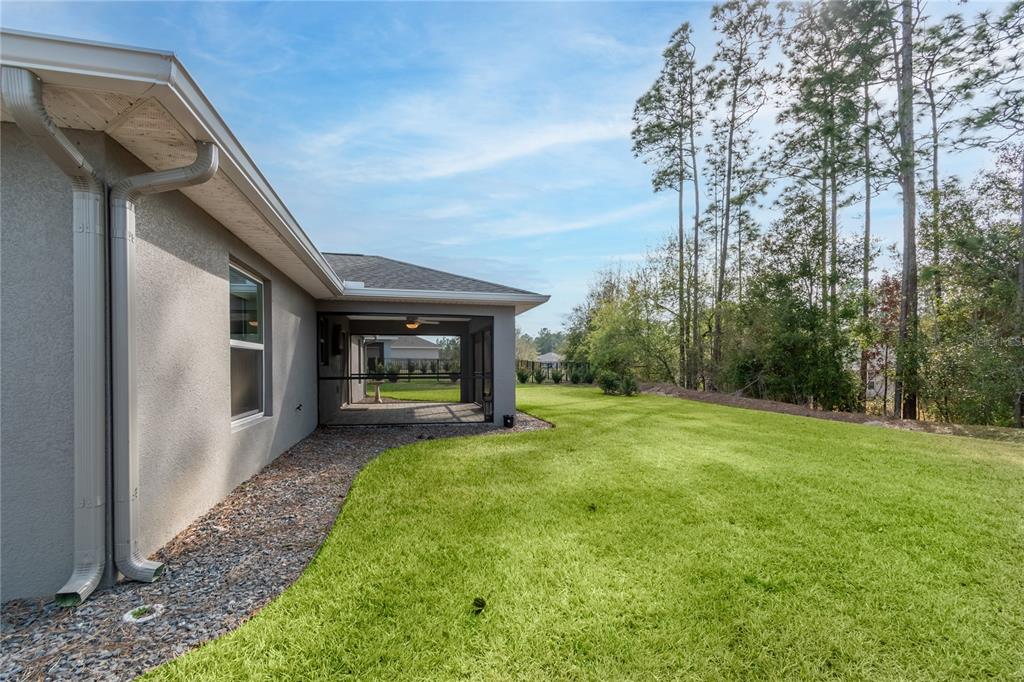 7052 Southwest 179th Ave Road Dunnellon, FL 34432 - Photo 11 of 42 a view of a house with backyard and garden