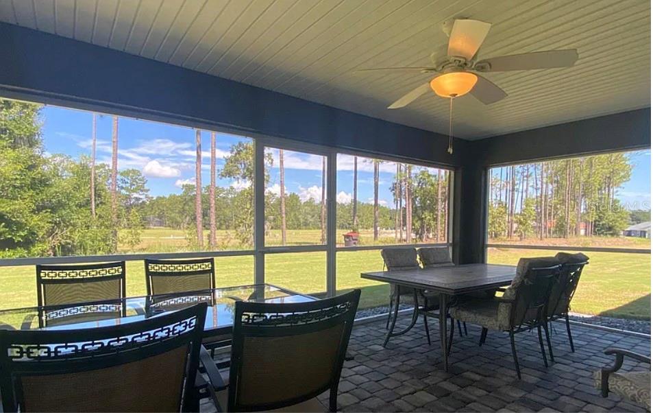 7052 Southwest 179th Ave Road Dunnellon, FL 34432 - Photo 11 of 11 a view of a dining room with furniture window and outside view