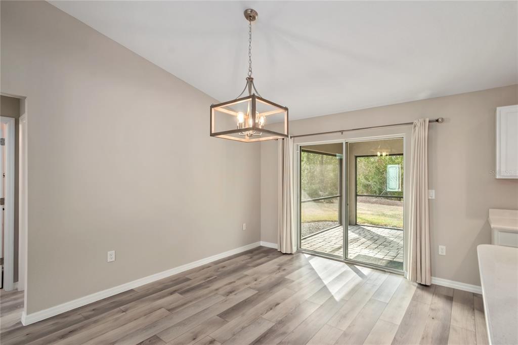 7052 Southwest 179th Ave Road Dunnellon, FL 34432 - Photo 17 of 42 a view of an empty room with wooden floor and a window