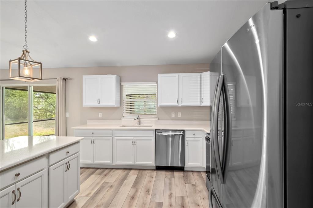 7052 Southwest 179th Ave Road Dunnellon, FL 34432 - Photo 23 of 42 a kitchen with a sink a window and stainless steel appliances