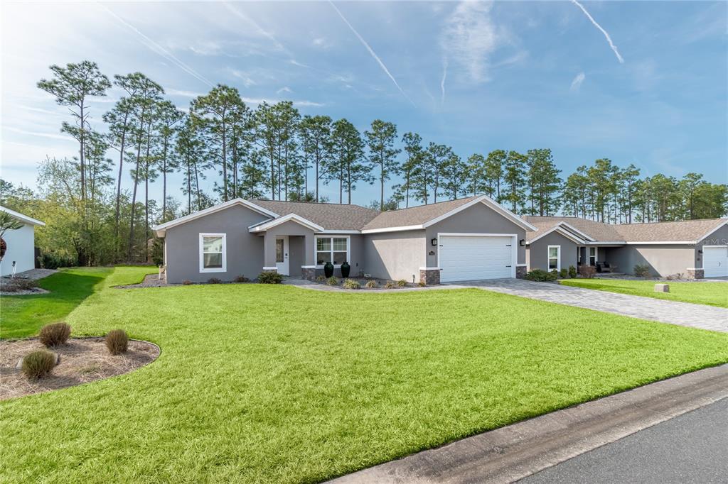 7052 Southwest 179th Ave Road Dunnellon, FL 34432 - Photo 3 of 42 a front view of a house with garden