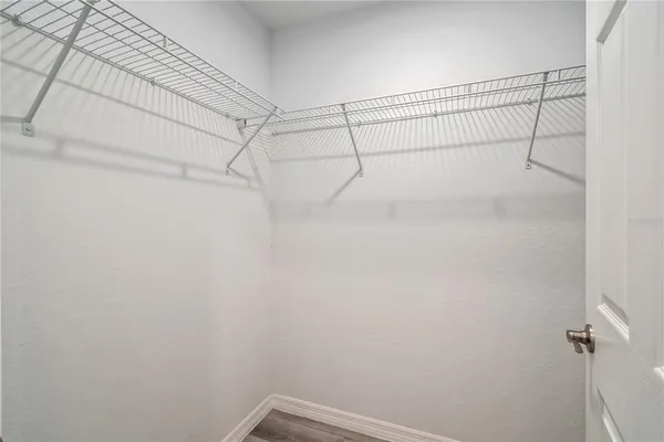 a view of a room with racks on the wall