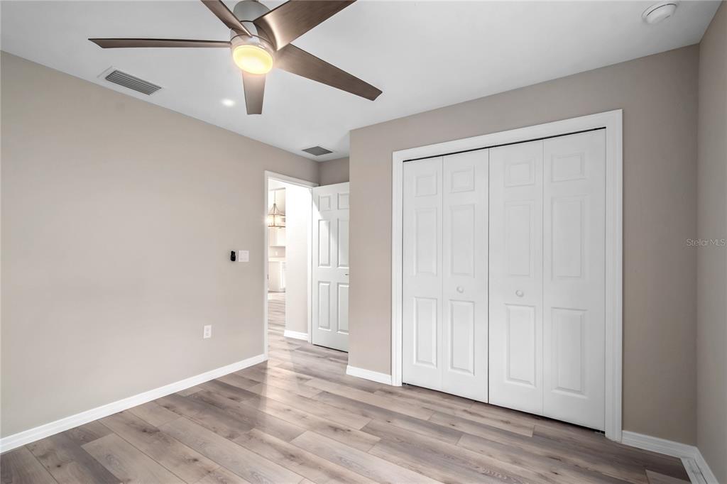 7052 Southwest 179th Ave Road Dunnellon, FL 34432 - Photo 36 of 42 an empty room with wooden floor closet and windows