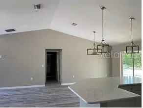 a view of a room with a ceiling fan