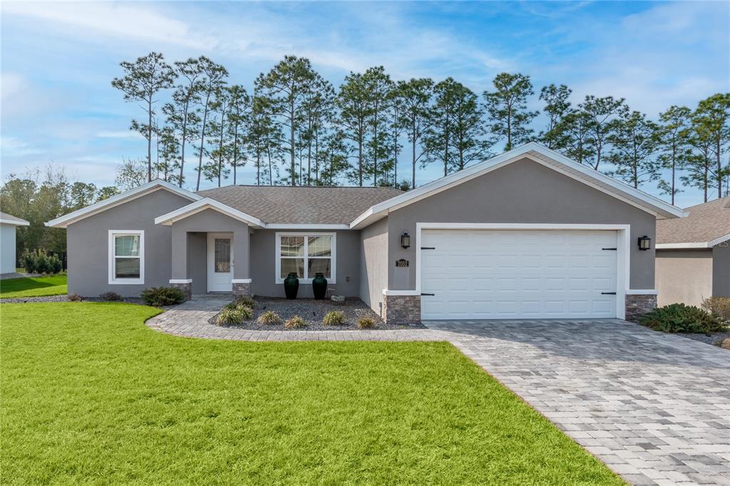 7052 Southwest 179th Ave Road Dunnellon, FL 34432 - Photo 4 of 42 a front view of a house with garden