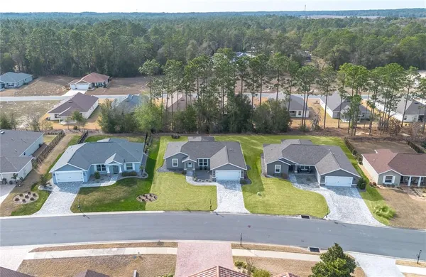 an aerial view of a house with swimming pool