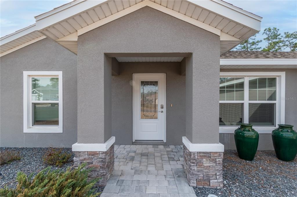 7052 Southwest 179th Ave Road Dunnellon, FL 34432 - Photo 5 of 42 a view of a house with chairs and table in a patio