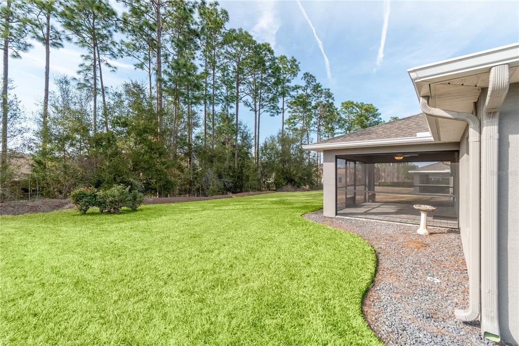 7052 Southwest 179th Ave Road Dunnellon, FL 34432 - Photo 7 of 42 a view of a house with a backyard