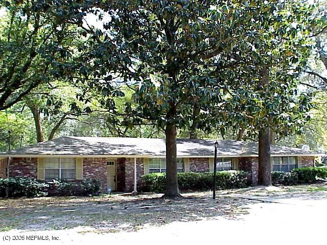 4051 Heath Road Jacksonville, FL 32277 - Photo 1 of 1 a front view of a house with a tree