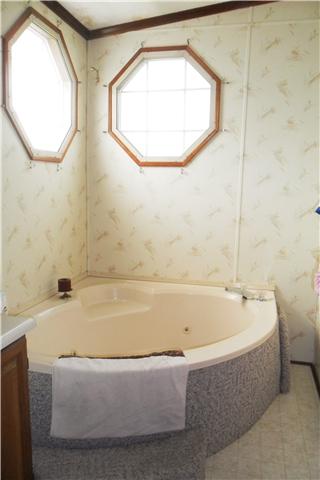 1824 Hayes Denton Road Columbia, TN 38401 - Photo 8 of 20 THE MASTER BATHROOM HAS A LARGE TUB, GLASS SHOWER, DOUBLE VANITIES AND A PRIVATE TOILET AREA.