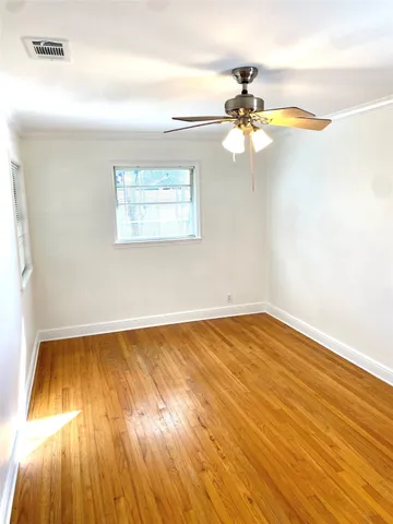 a bathroom with a sink mirror vanity and toilet
