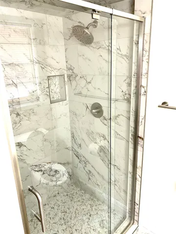 a view of a swimming pool with an outdoor space and seating area