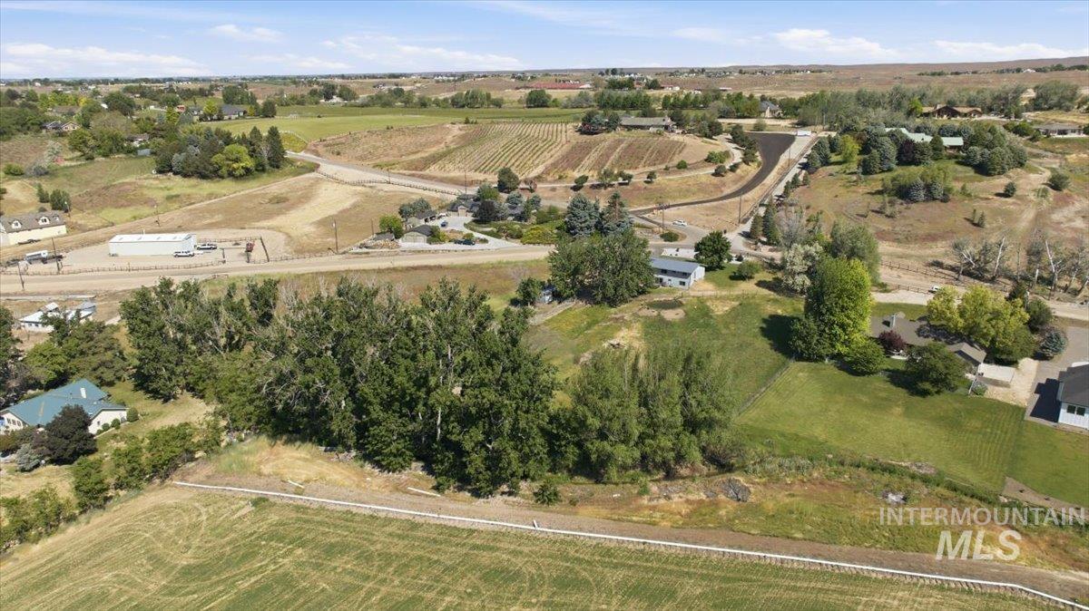 6323 Foothill Road Star, ID 83669 - Photo 45 of 50 Expansive rural landscape featuring a mix of agricultural fields, mature trees, and scattered residences