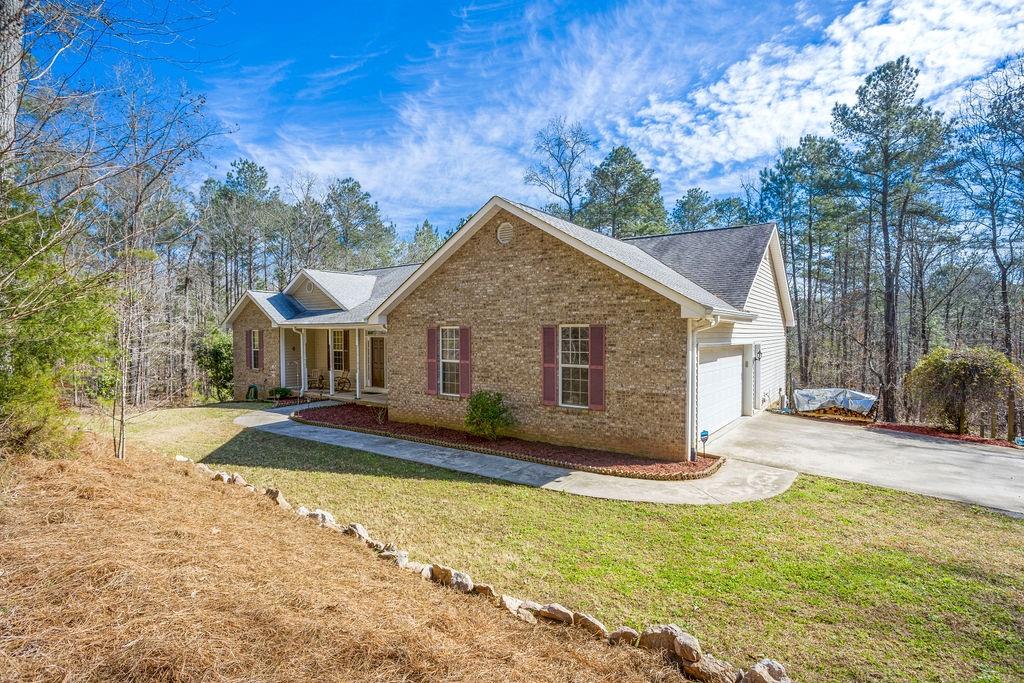 3840 Peeksville Road Locust Grove, GA 30248 - Photo 1 of 1 a view of a house with pool and sitting area