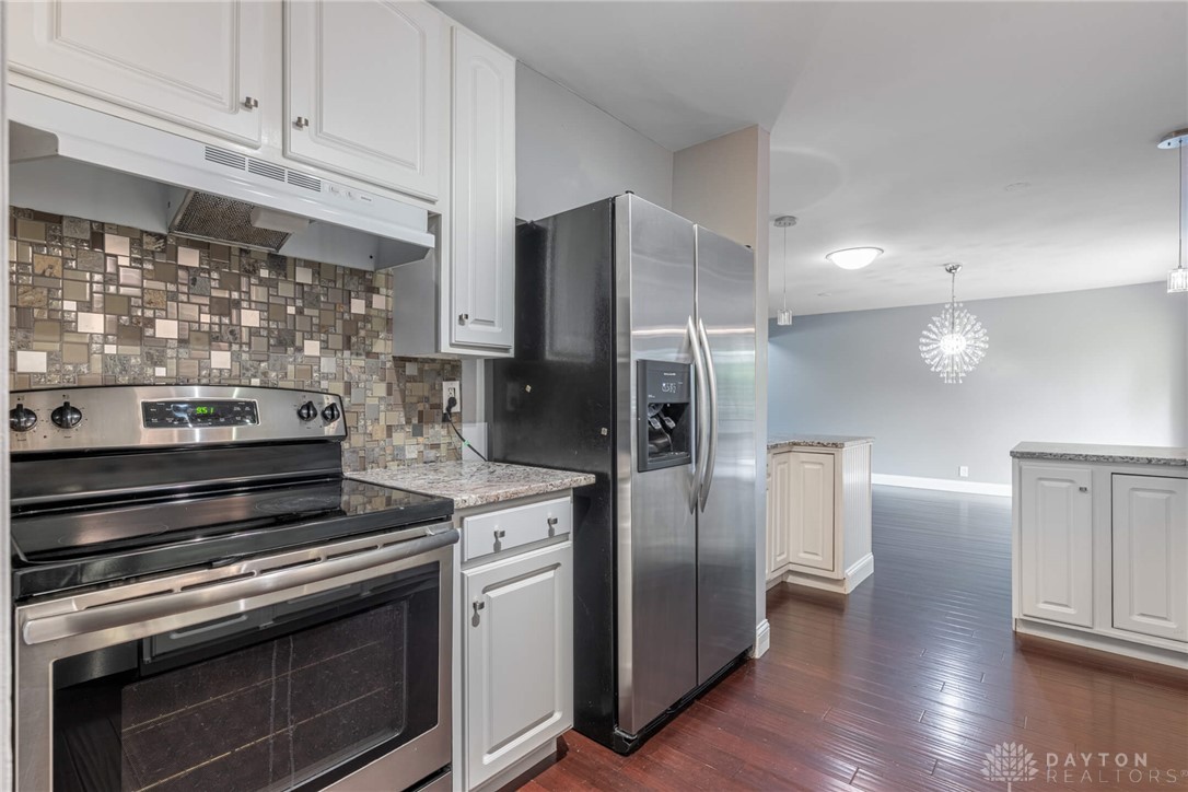 467 West Rahn Road Dayton, OH 45429 - Photo 12 of 41 This modern kitchen features gleaming appliances and rich wood flooring, perfect for contemporary living.