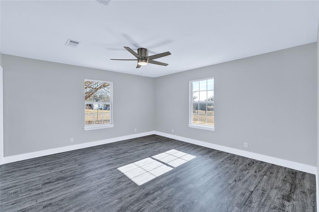 566 McCraw Lane Denison, TX 75021 - Photo 17 of 25 a view of workspace with wooden floor and window