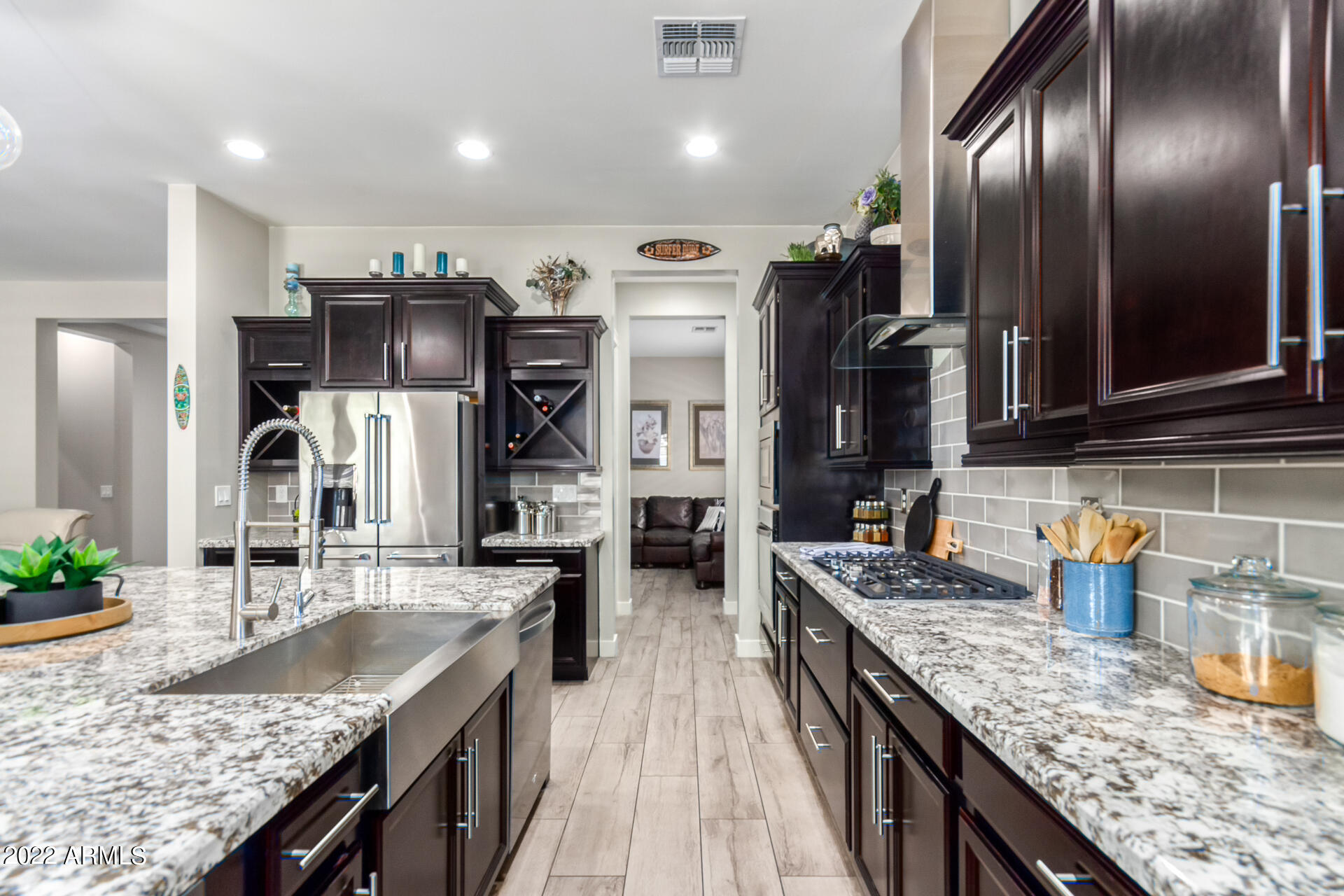 28001 92nd Avenue Peoria, AZ 85383 - Photo 13 of 45 a kitchen with granite countertop stainless steel appliances and sink