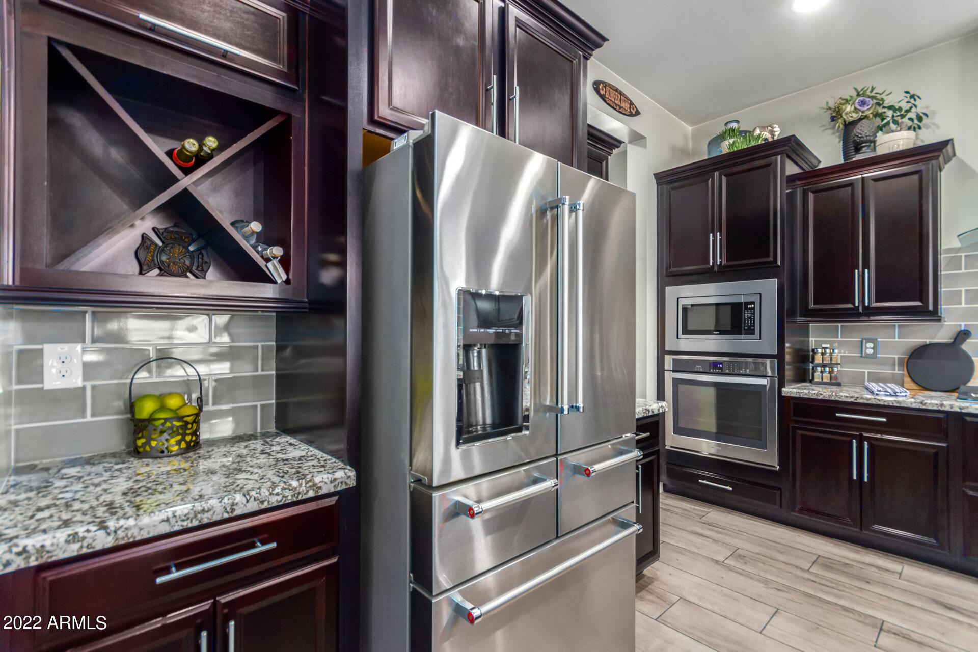 28001 92nd Avenue Peoria, AZ 85383 - Photo 15 of 45 a kitchen with stainless steel appliances a refrigerator and stove