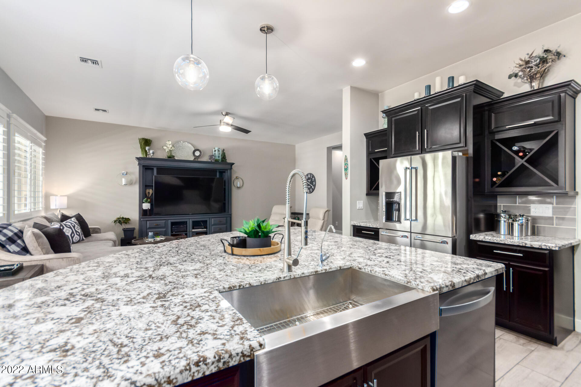 28001 92nd Avenue Peoria, AZ 85383 - Photo 16 of 45 a kitchen with stainless steel appliances granite countertop a sink a stove and a refrigerator