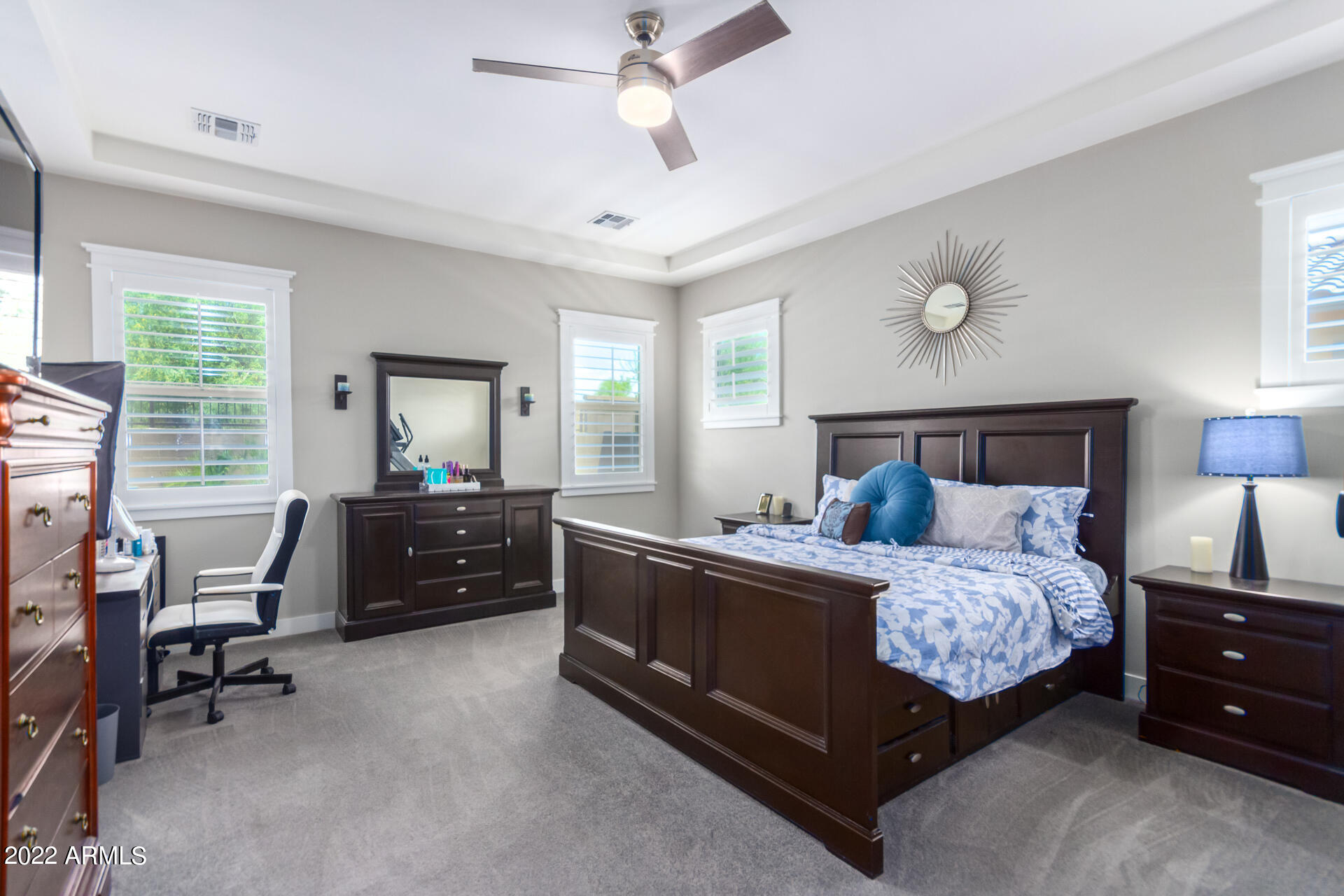 28001 92nd Avenue Peoria, AZ 85383 - Photo 21 of 45 a bedroom with a bed and a chandelier