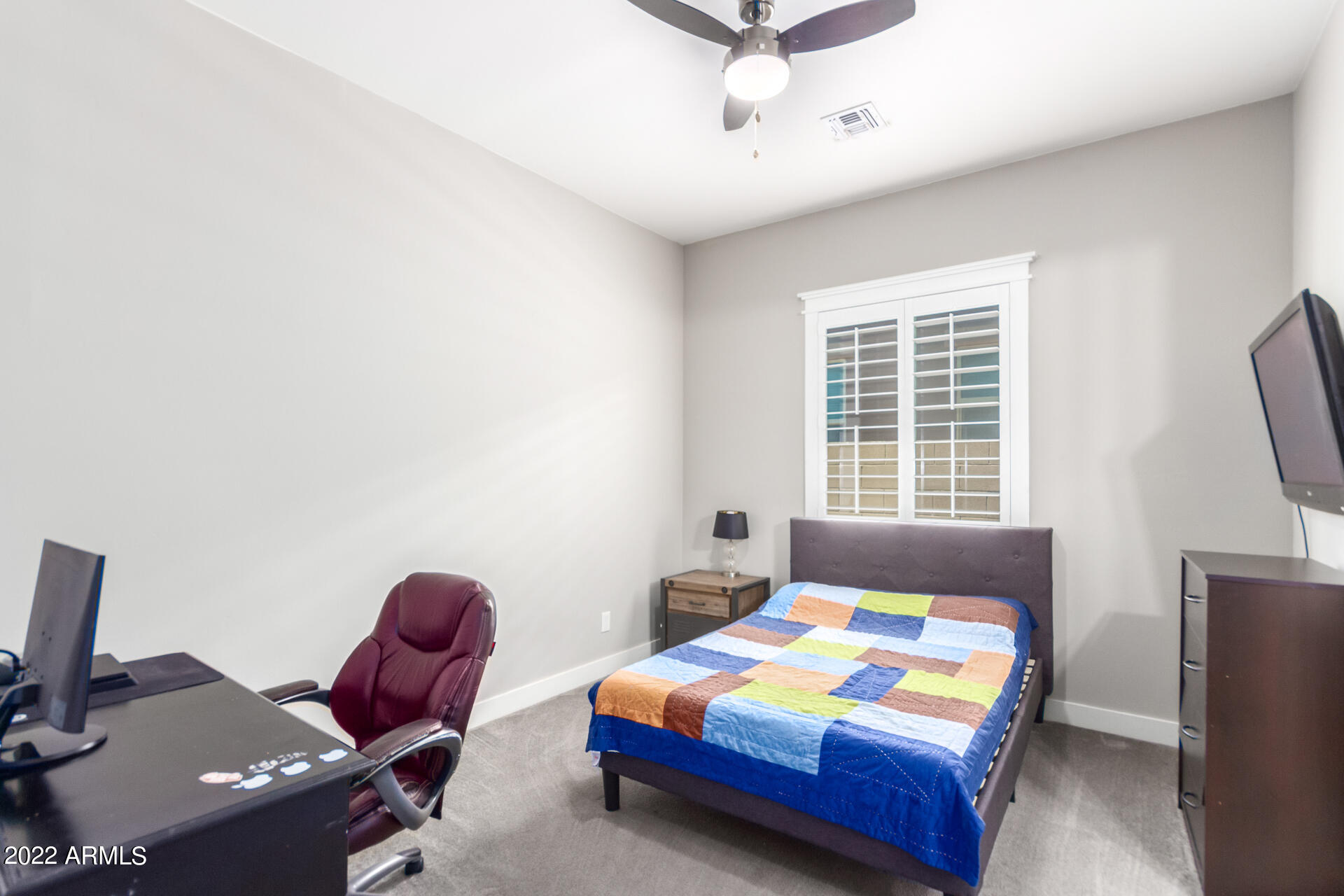 28001 92nd Avenue Peoria, AZ 85383 - Photo 30 of 45 a bedroom with a bed and a window